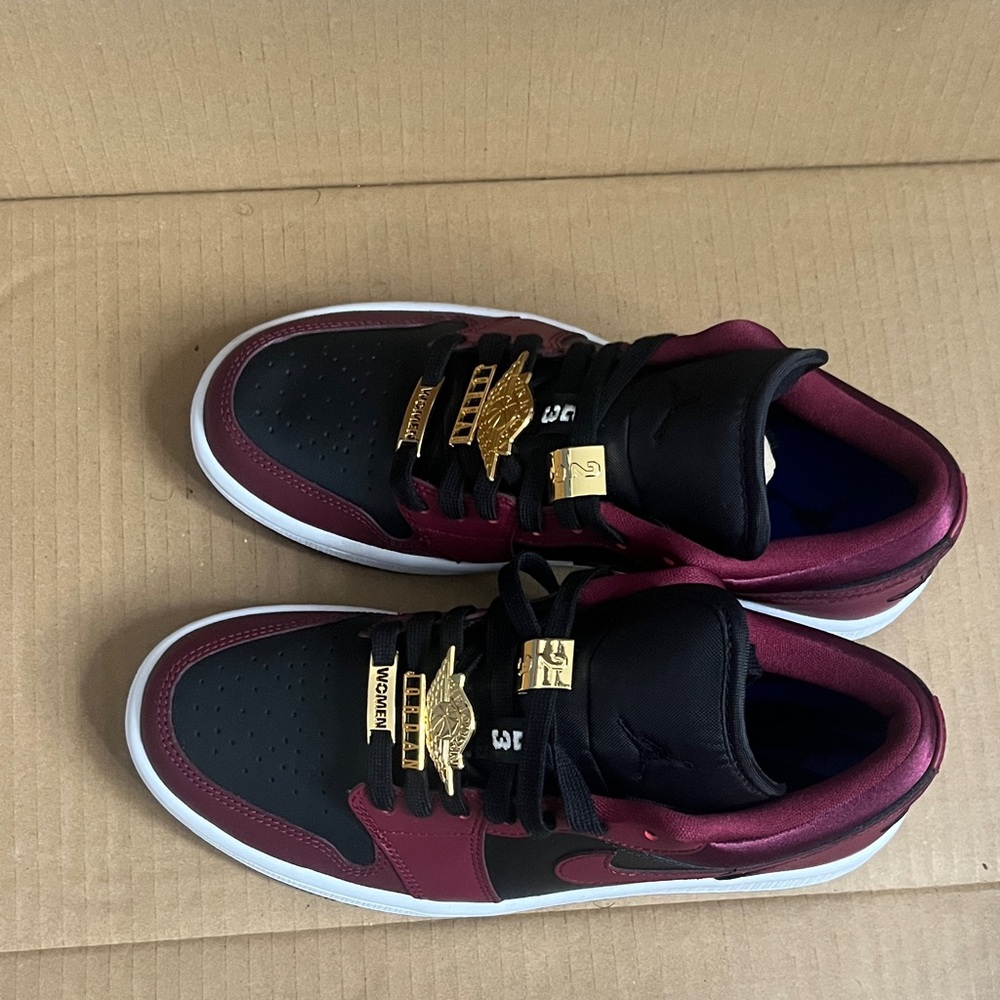 Nike Black and Burgundy Sneakers with Gold Accents